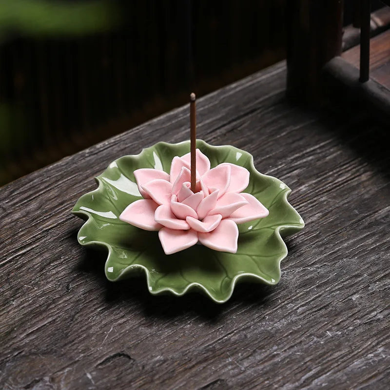 Ceramic Lotus Incense Burner - Handmade on a wooden surface with pink lotus design for serene incense burning.